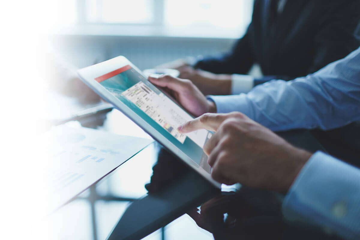 Business people working with a tablet Business people working with a tablet